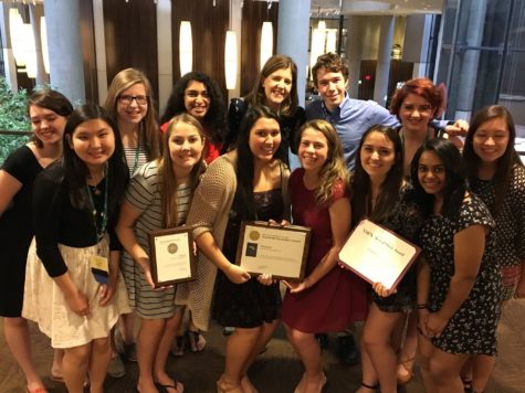 The staff of the Glenbrook South High School Yearbook enjoys its 2016 Pacemaker while in Los Angeles for the JEA/NSPA Convention.