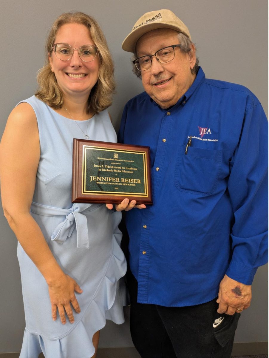 Randy Swikle poses with daughter IJEA Vice President Jennifer Reiser after she accepted IJEA's James A. Tidwell Award for Excellence in Scholastic Media Education.